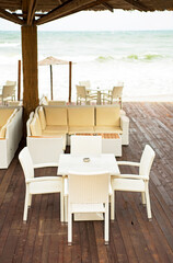 Bad weather. Storm. There are no people in the cafe on the beach. Empty beaches in Bulgaria next to the stormy sea