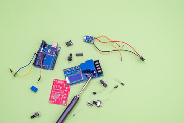 Soldering iron and electronics parts, printed circuit boards, wires as a concept of electrical work