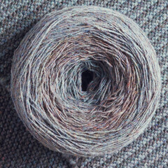Round skein of wool yarn. Hobby, knitting, needlework.