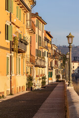 Fototapeta na wymiar Old facades of houses in sunrise, Verona, Italy, Europe