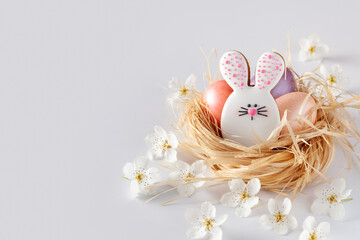 Happy Easter. Сomposition made of Easter cookie and eggs in a nest. Close-up. Copy space.