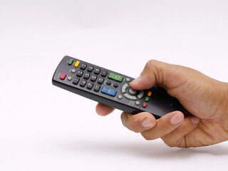 Human hand holding TV remote