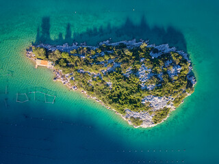 Aerial drone view of a small island in the bay of Mali Ston located on Peljesac peninsula. Oyster...