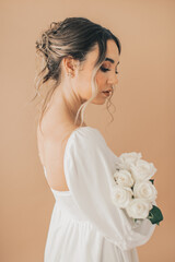Close Up of Woman Elegantly Holding White Roses