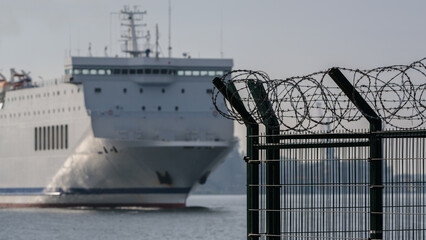  
PROTECTING SITE - Separating seaport with fence and razor wire 
