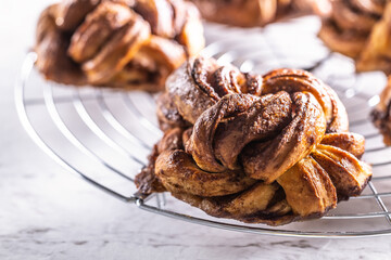 Freshly baked, caramel-cinnamon buns on the kitchen grill