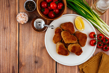 fried chicken nuggets in the shape of a heart on a plate, mustar