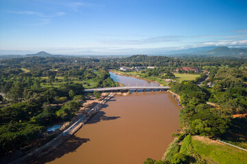 Aerial view of drone flying above Kok River, Chiang Rai Province, Thailand - 571174587