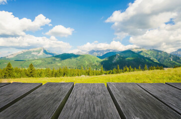 Empty wooden table with beautiful landscape background