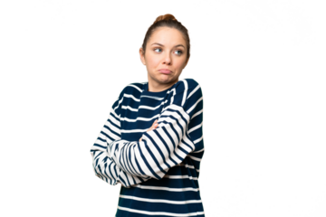 Young blonde woman over isolated chroma key background making doubts gesture while lifting the shoulders