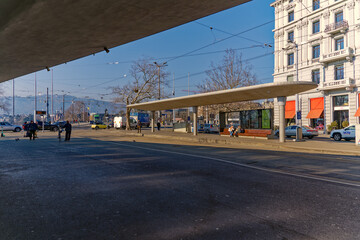 Tram station with waiting passengers at Bellevue Square at City of Zürich on a sunny winter day. Photo taken February 9th, 2023, Zurich, Switzerland.