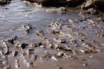 Landscape of sand and sea water in volcanic zone in the canary islands
