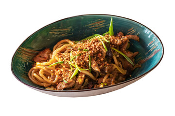 Wok noodles with meat, grated walnuts and green onions. Isolated on white background