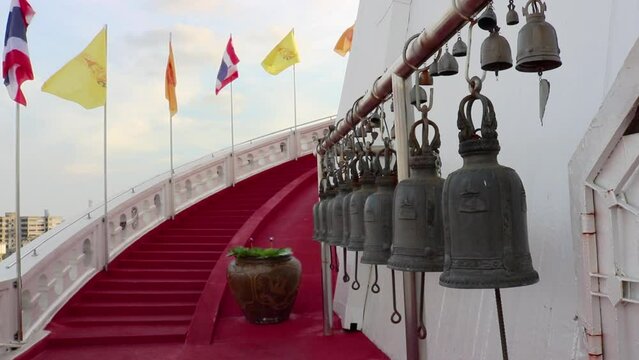 Buddhist bells and the National Thai flag and Dharmachakra flag in Bangkok, Golden Mount Temple (Wat Saket), Thailand.