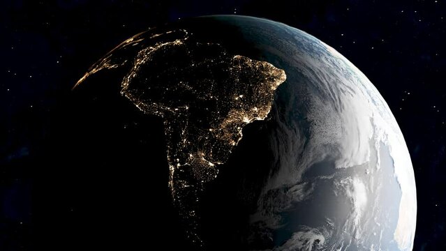 Night satellite view from space over South America with glowing city lights