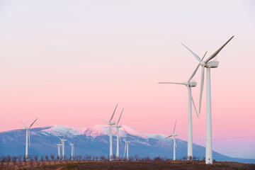 Wind turbine generators for renewable electricity production and snow mountain © WINDCOLORS