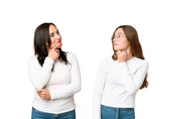 mother and daughter over isolated chroma key background standing and thinking an idea