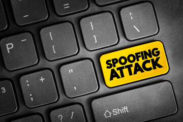 Fototapeta premium Spoofing Attack - situation in which a person or program successfully identifies as another by falsifying data, text button on keyboard