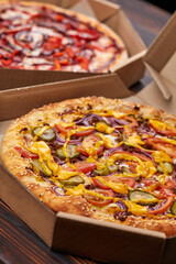 pizza  in the box on the wooden background