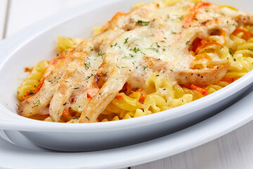 roasted vegetables with meat and cheese