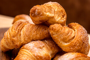Croissant. Bakery. croissant stacked on a wooden board.