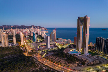 Benidorm coastline at sunset. Aerial shot by drone. Benidorm island in the background. Intempo...