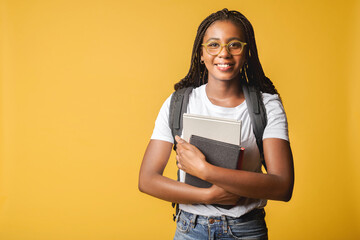 Nice attractive young 20s student girl in basic white t-shirt and glasses standing with backpack...