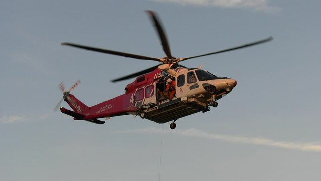 Rescue helicopter conducting lift operations