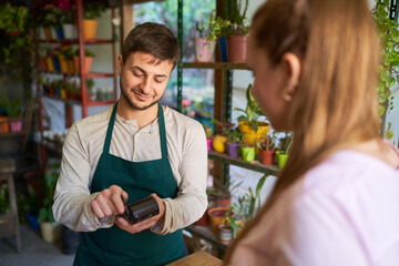 Florist and customer making contactless payments