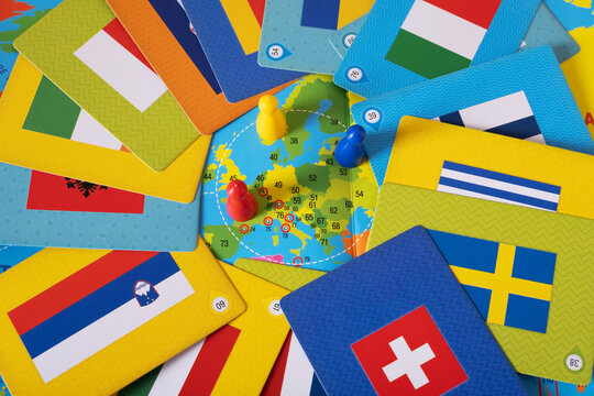Board geography game with flags, world map and chips