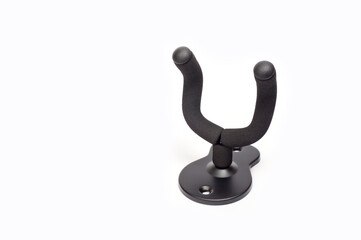 Wall mount for an acoustic or electric guitar, shot against a white background.
