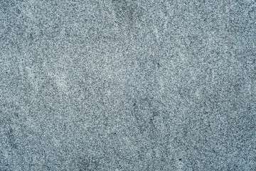 Granite background with fine texture. Facing plates from gray granite.