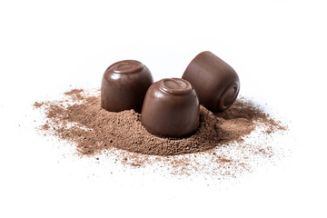Obraz na płótnie Canvas Chocolate bonbons and cocoa powder isolated on white background