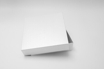 White textured opened box, gift mockup on white background.High resolution photo. Blank White Product Package Box Mock-up. Container, Packaging Template on white. Cardboard box.