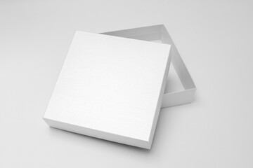 White textured opened box, gift mockup on white background.High resolution photo. Blank White Product Package Box Mock-up. Container, Packaging Template on white. Cardboard box.