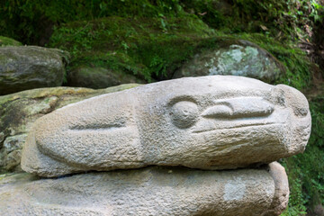 San Agustin (San Agustín), Huila, Colombia : close-up of a pre-columbian megalithic sculpture on display in the archaeological park. Impressive funeral megalithic statue carved with volcanic stone.