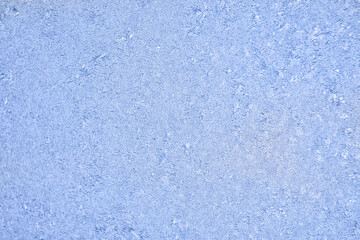 Frosty frost on a glass window. Close-up of ice patterns lightly blurred in soft focus.