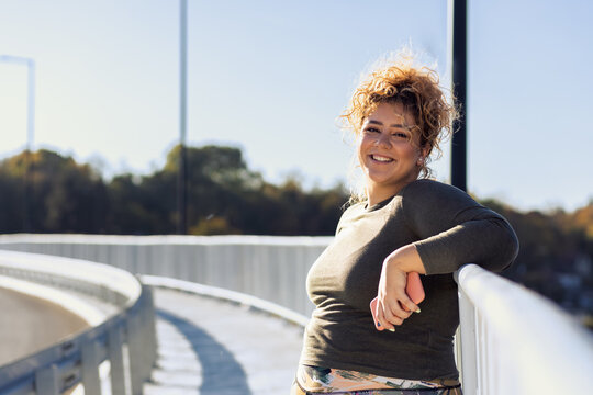 Portrait of young plus size women relaxing after running.