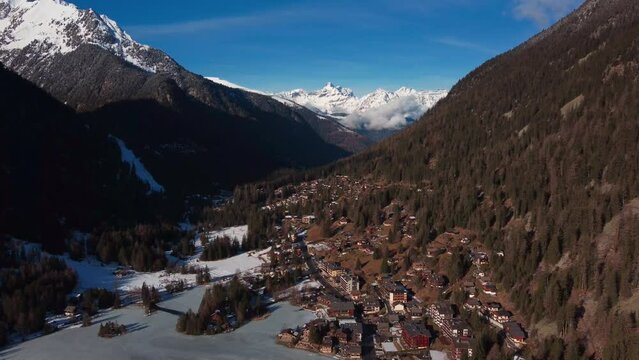 Aerial view of the beautiful valley at lac champex in the Swiss Alps. Towering ice capped mountain in the distance.