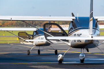 Two small planes prepare to flight on airport. - obrazy, fototapety, plakaty