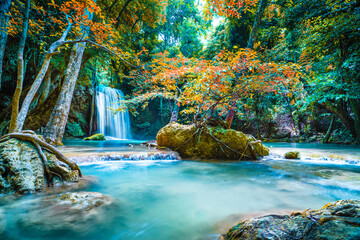 Waterfalls in the emerald blue water in Erawan National Park. Erawan Waterfall is a beautiful natural rock waterfall in Kanchanaburi, Thailand.Onsen atmosphere.