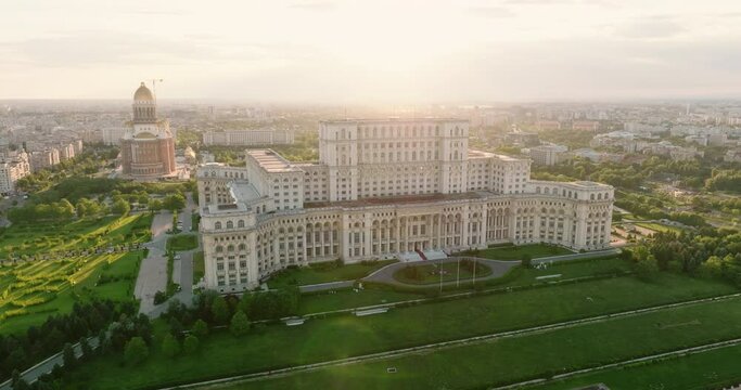 Palace of Parliament in Bucharest, Romania history Center aerial view at dawn in summer against blue sky