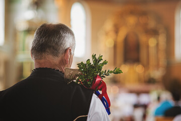 wedding elder in silent prayer at a church wedding
