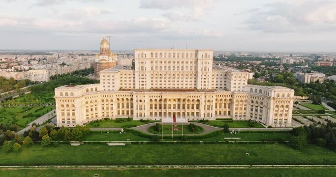 Palace of Parliament in Bucharest, Romania history Center aerial view at dawn in summer against blue sky