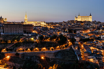 Obraz premium Views at night of Toledo. It is a city and municipality of Spain, capital of the province of Toledo in the autonomous community of Castilla–La Mancha. Toledo was declared a UNESCO World Heritage Site.