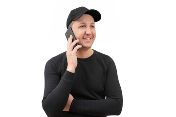 Young happy man in a sweatshirt and baseball cap using a smartphone on a white background. Sports lifestyle