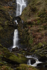 the tall Pistyll Rhaeadr waterfall in north wales from the bottom of it	
