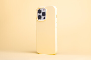 iPhone 13 and 14 Pro Max in yellow banana case back side view isolated on yellow background,...