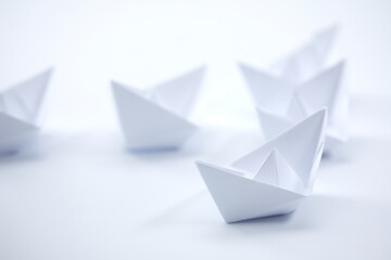 paper boats on the documents