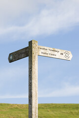Walking sign post on the Brenig Way archaeological trail at Llyn Brenig reservoir in the Denbigh moors in Wales allowing visitors locate bronze age monuments in the area 